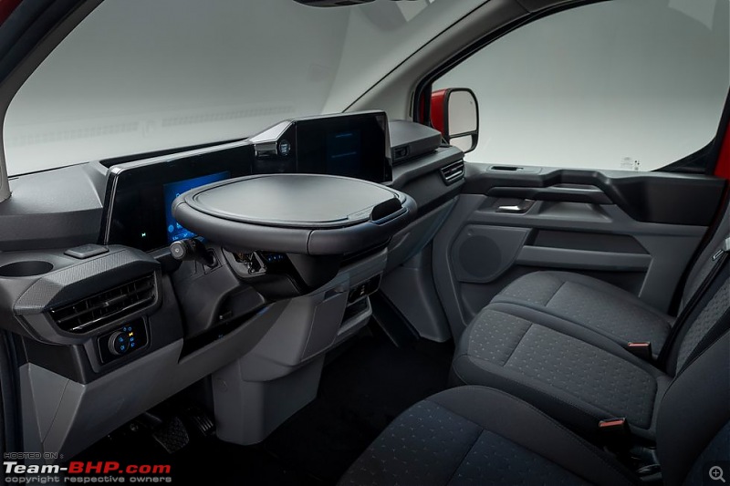 Ford offers its Transit vans with a steering wheel which easily folds into a tray table-fordtransittray.jpg