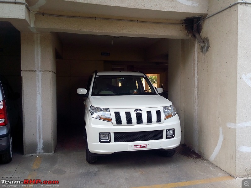 Orange Tank to conquer the road - Mahindra TUV3OO owner's perspective-test-drive-car-my-apartment-parking-seen-front.jpg