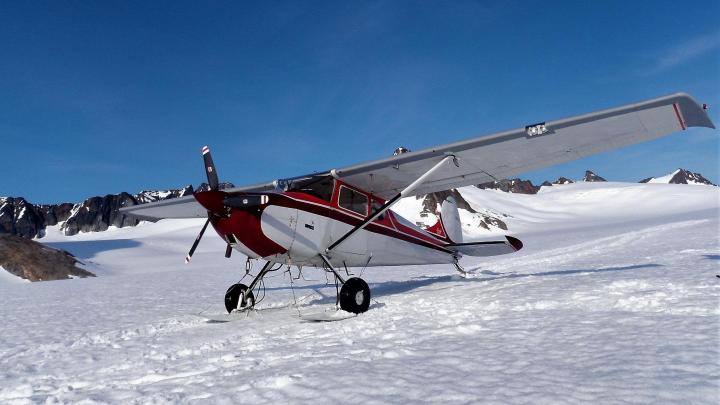 2 guys & a dog flew to Juneau Icefield in Alaska in old Cessna aircraft 