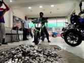 Dude buys bike with 1-rupee coins