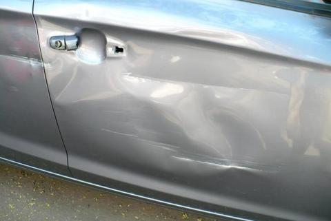 Dent repair at a local garage and its impact on future car insurance claims